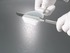 Dosing spoon, stripper edge